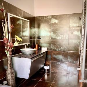 a bathroom with a sink and a mirror at Residenza stadio in Turin