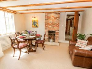 a living room with a table and a fireplace at 19 Clatterford Shute in Newport