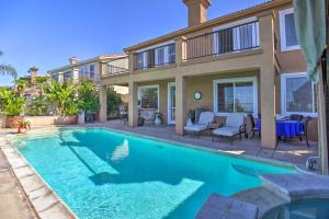a swimming pool in front of a house at Luxury San Diego Home with Pool, Spa and Views! in San Diego