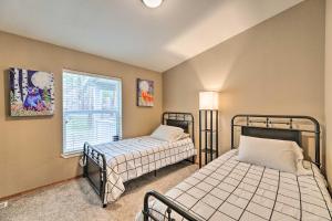 a bedroom with two beds and a window at Rustic Escape with Deck, Hot Tub and Mountain Views in Irwin