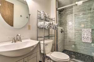 a bathroom with a sink and a toilet and a shower at Walk to Lake and Beach Pocono Cabin with Fire Pit in Pocono Lake +36 photos