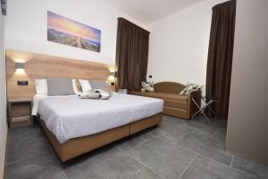 Postel nebo postele na pokoji v ubytování Hotel Crisvan