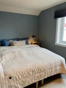 Postel nebo postele na pokoji v ubytování Lofoten_Beach_Hollyday_House_Eggum