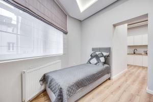 Ένα ή περισσότερα κρεβάτια σε δωμάτιο στο Central Platinum Apartments 29