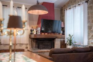TV a/nebo společenská místnost v ubytování Residenza San Fortunato