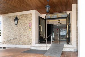 an entrance to a building with a revolving door at Hotel Castro in Santiago de Compostela