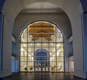 an entrance to a building with a large glass window at La Recova Hotel & Spa in La Punta