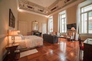 Postel nebo postele na pokoji v ubytování Royal Palace Hotel