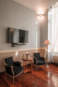 TV a/nebo společenská místnost v ubytování Royal Palace Hotel