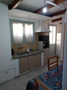 a kitchen with a sink and a counter top at TRINIDAD in San Juan