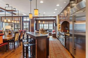 a kitchen with a bar and a dining room at Flagstaff #202 in Park City