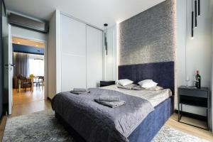 Ένα ή περισσότερα κρεβάτια σε δωμάτιο στο Apartament Szafir