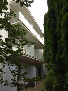 a large white building with a balcony on it at Apartamenty Przy Morzu Dominikana in Sianozety