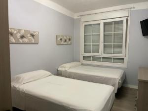 Postel nebo postele na pokoji v ubytování La Rosa Azul Rooms-Grupo Rosa Azul + 130 fotografií