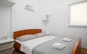 Postel nebo postele na pokoji v ubytování Apartman Rusula Vodice