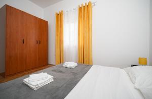 Postel nebo postele na pokoji v ubytování Apartman Rusula Vodice