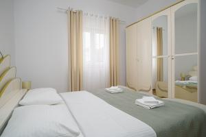 Postel nebo postele na pokoji v ubytování Apartman Rusula Vodice