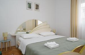 Postel nebo postele na pokoji v ubytování Apartman Rusula Vodice