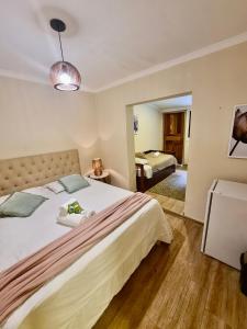 Ένα ή περισσότερα κρεβάτια σε δωμάτιο στο Pousada Casa Mantiqueira - Próxima ao Capivarí e opções de Hidromassagem +85 φωτογραφίες