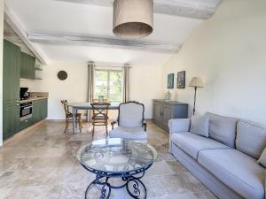 a living room with a couch and a table at **LOVELY APARTMENT IN THE CASTLE OF LA REDORTE** in Laredorte