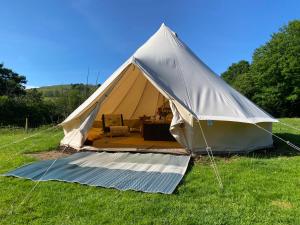 a large tent in a field of grass at Black Mountains Glamping in Abergavenny