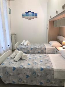 Ліжко або ліжка в номері Casa di Riccardo