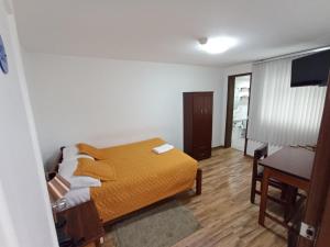 Postel nebo postele na pokoji v ubytování Hotel 9 de Octubre
