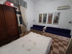 Postel nebo postele na pokoji v ubytování Villa Daphne