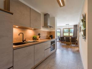a kitchen with a sink and a counter at Reh4 Appartement in Westendorf
