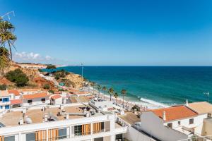 a view of the ocean from a building at Appartement ALGARDEN Olhos d'Agua in Olhos de Água