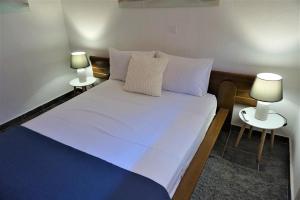 A bed or beds in a room at katerina's Villa