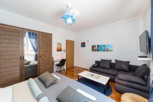 a living room with a couch and a table at Family in Gradac