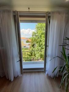 an open door with a view of a balcony at Beautiful apartment in the city center in Spišská Nová Ves