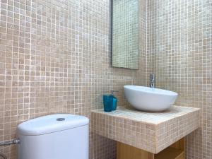 Łazienka w obiekcie Apartamentos LlAMAR