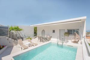 a swimming pool on the roof of a house at Onirion Homes : Stella's Home in Kolymvari