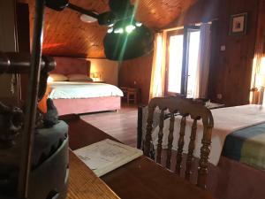 a bedroom with a bed and a desk with a chair at Enam Room in Kojsko +172 photos