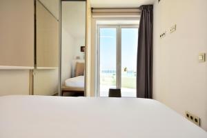 Postel nebo postele na pokoji v ubytování Atico Suite Ola Blanca + 25 fotografií