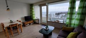 Posezení v ubytování MEERBLICK PERLE, 3-RAUM-FEWO AM HANSAPARK