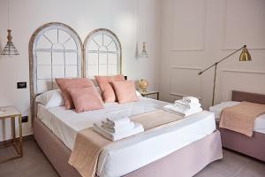 Postel nebo postele na pokoji v ubytování Dimora Terranova Charming Rooms
