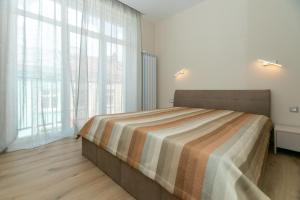 Ένα ή περισσότερα κρεβάτια σε δωμάτιο στο Луксозни студия “Старият Батак” / Luxury studios “The Old Batak”