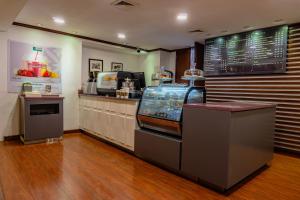 a fast food restaurant with a cash register and a counter at Gamma Monterrey Gran Hotel Ancira in Monterrey +134 photos