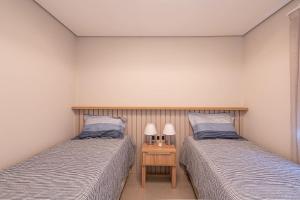 Posteľ alebo postele v izbe v ubytovaní Incrivel apartamento com WiFi na Praia Brava SC