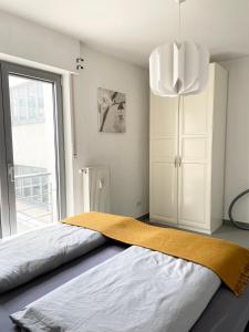 Innenstadt Neumarkt-Schildergasse stylische Wohnungにあるベッド