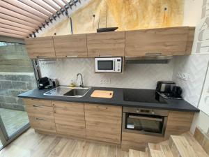 Kuchyňa alebo kuchynka v ubytovaní Maison bord de mer « Le Bateau IvRe »