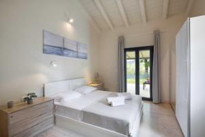 Posteľ alebo postele v izbe v ubytovaní Casa Serenity