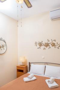 Postel nebo postele na pokoji v ubytování Dili Apartments