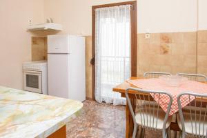 Kuchyň nebo kuchyňský kout v ubytování Dili Apartments