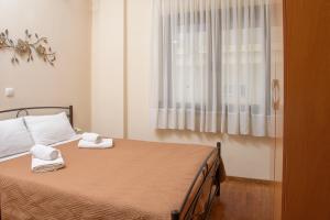 Postel nebo postele na pokoji v ubytování Dili Apartments