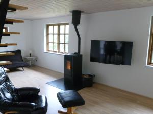 A television and/or entertainment centre at Holiday House Billundvej 74