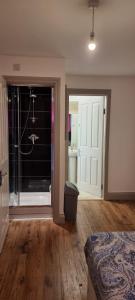a bedroom with a door leading to a bathroom at 3 bed bedroom house with garden in Thamesmead